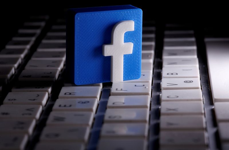 FILE PHOTO: FILE PHOTO: A 3D-printed Facebook logo is seen