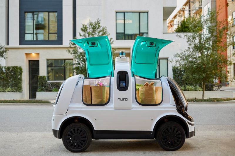 A self-driving delivery firm Nuro’s R2 vehicle with groceries inside