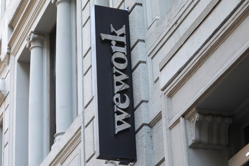 A sign is seen above the entrance to the WeWork