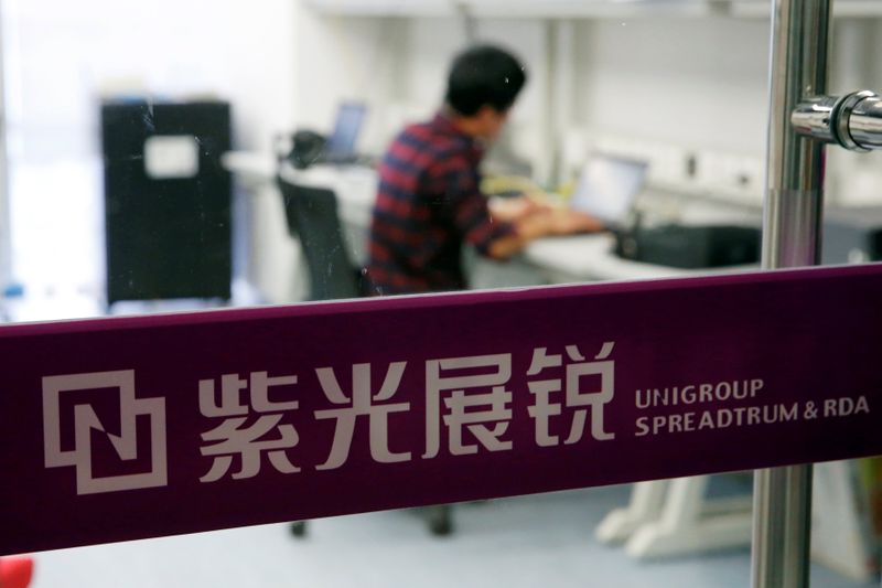 A researcher works at Tsinghua Unigroup research centre in Beijing