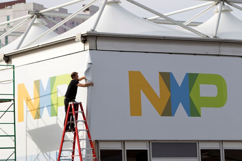 A man works on a tent for NXP Semiconductors in