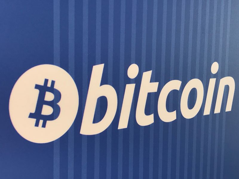FILE PHOTO: A Bitcoin logo is seen on a cryptocurrency