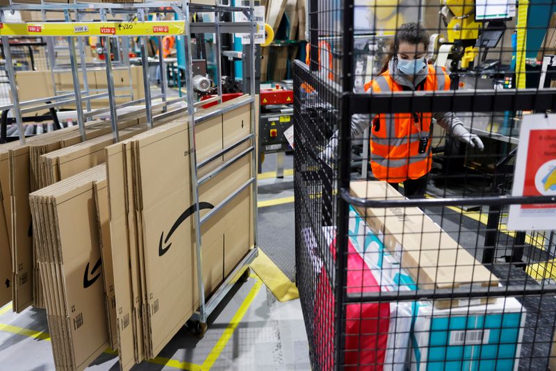 FILE PHOTO: Employees work at the Amazon fulfilment center in