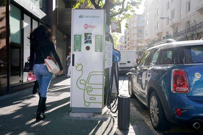 FILE PHOTO: An electric car is charged from an Iberdrola