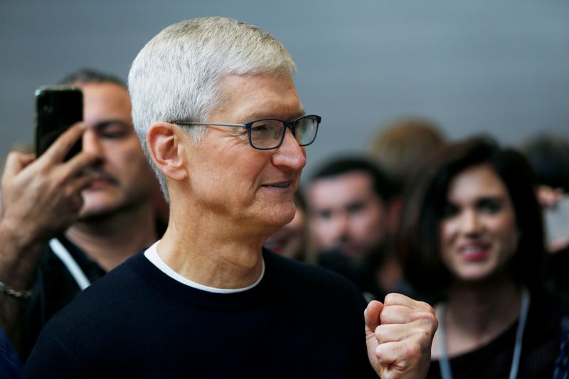Apple CEO Tim Cook gestures during a product launch event