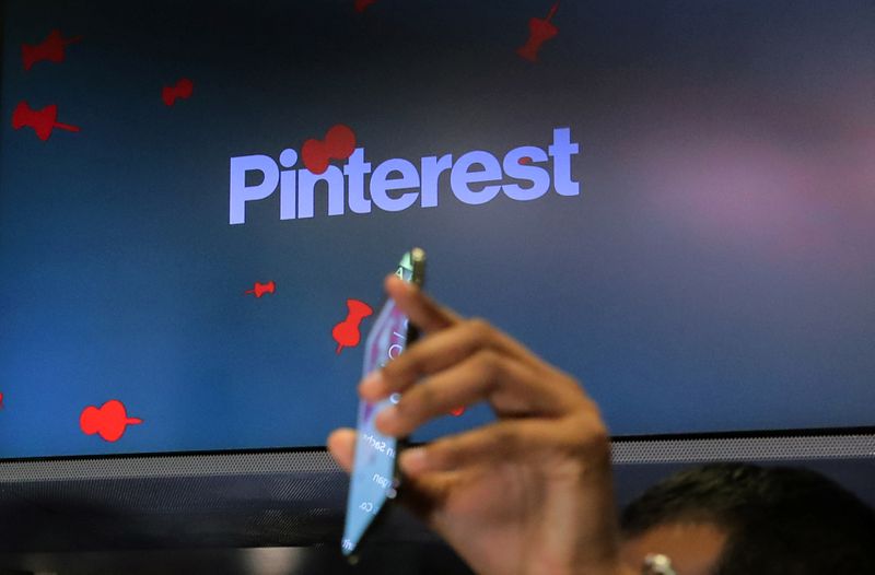 A guest hold up a phone during the Pinterest Inc.