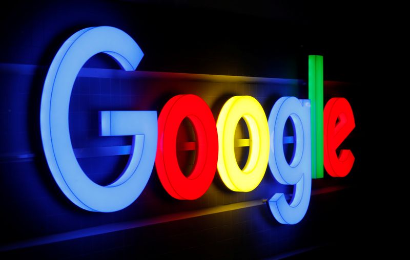 An illuminated Google logo is seen in Zurich