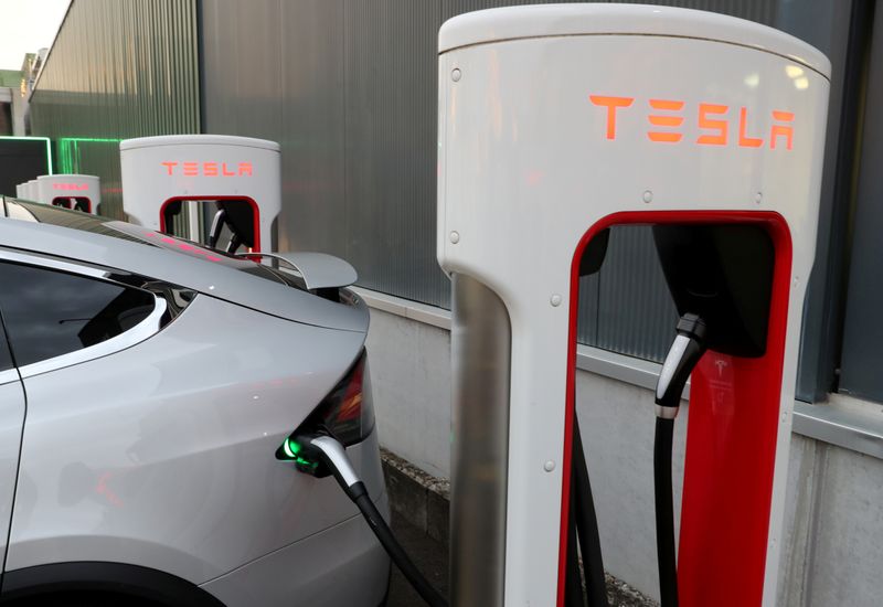 FILE PHOTO: A Tesla Supercharger station is seen in Dietikon
