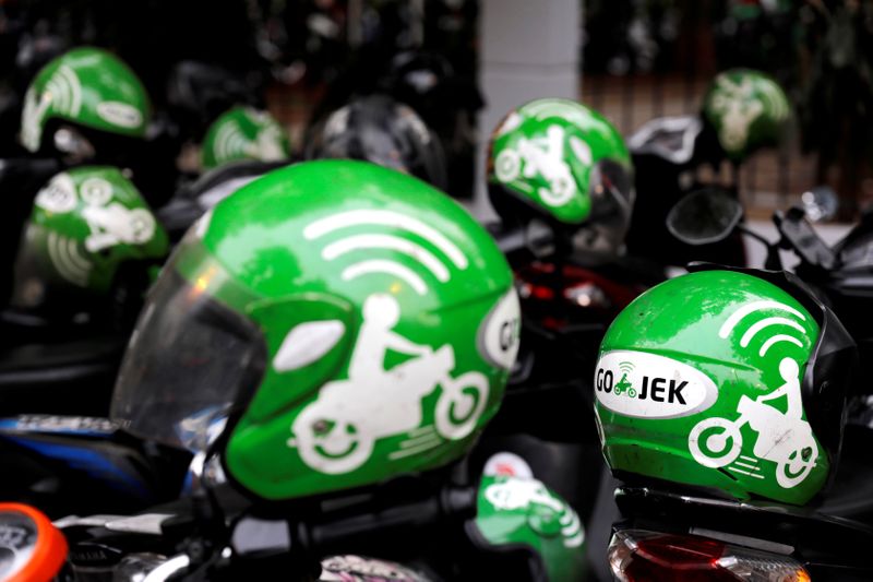 FILE PHOTO: FILE PHOTO: Gojek driver helmets are seen during