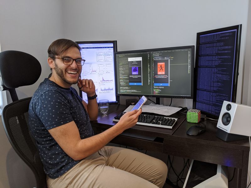 Luke Tsekouras, a site reliability engineer, working on his newly