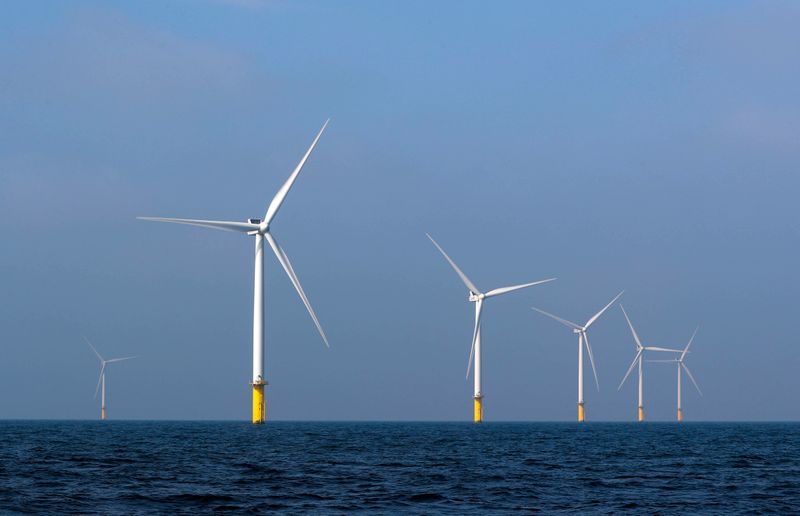 Power-generating windmill turbines are seen at the Eneco Luchterduinen offshore