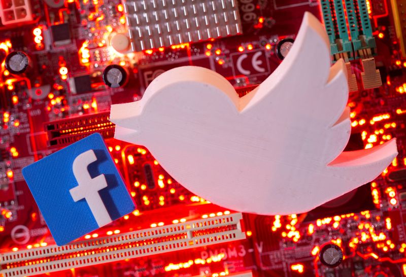 FILE PHOTO: Illustration of 3D printed Facebook and Twitter logos