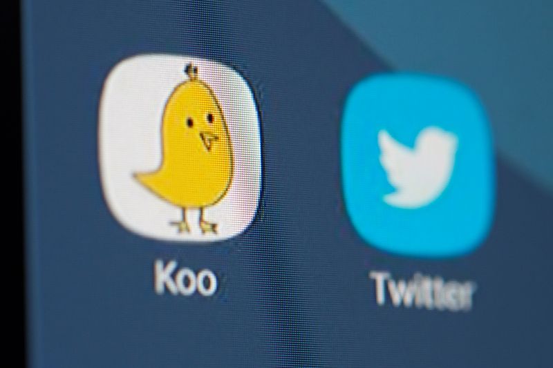 Twitter and Koo app logos are seen on smartphone in