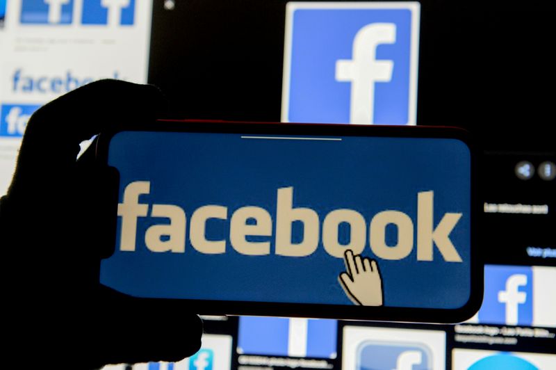 FILE PHOTO: The Facebook logo is displayed on a mobile