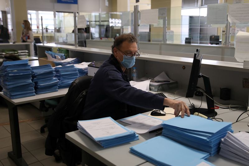 An employee works at a Greek Manpower Employment Organisation (OAED)