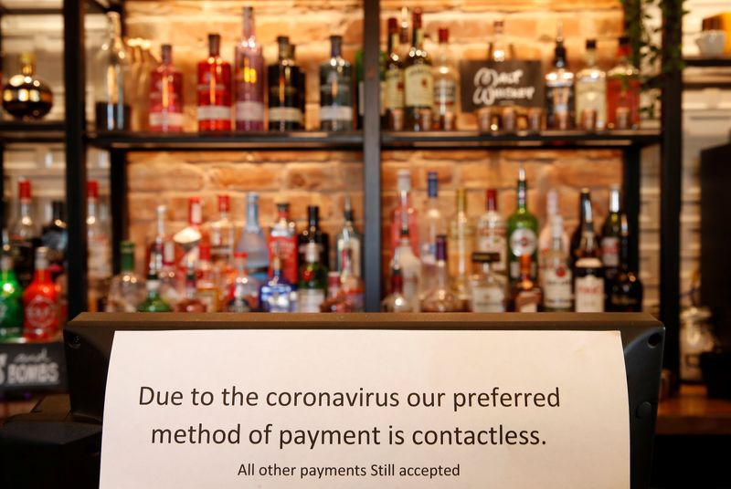 A sign asking customers to only use contactless payment methods