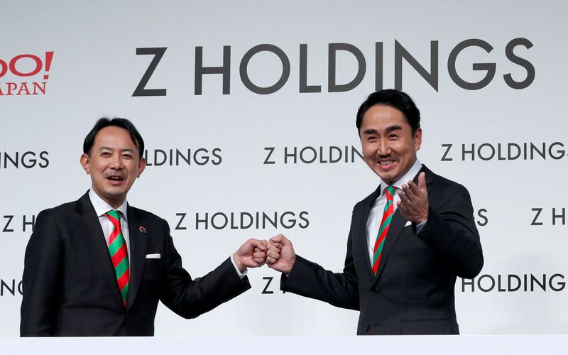 FILE PHOTO: Co-CEOs of Z Holdings Kawabe and Idezawa hold