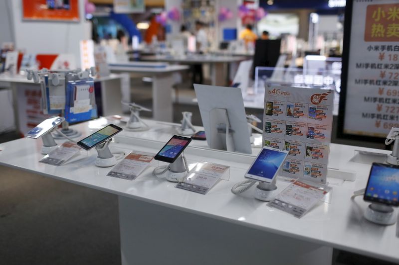 Mobile phones are seen on display at an electronics market