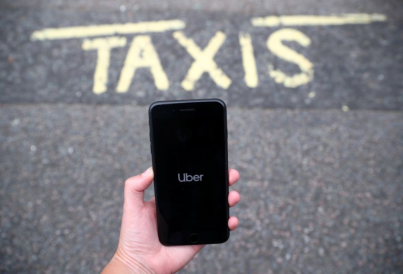 The Uber application is seen on a mobile phone in