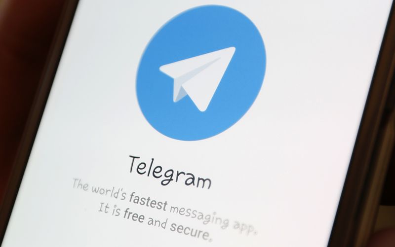 The Telegram logo is seen on a screen of a