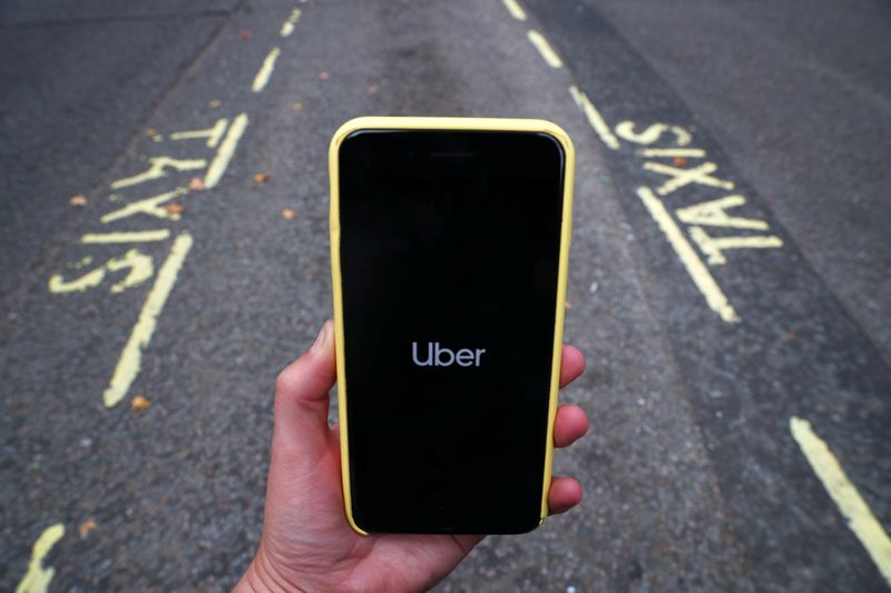 The Uber application is seen on a mobile phone in