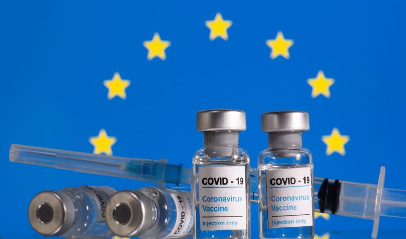 FILE PHOTO: Vials labelled “COVID-19 Coronavirus Vaccine” and syringes are
