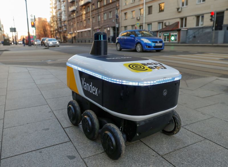 FILE PHOTO: Yandex robots deliver restaurant meals in central Moscow