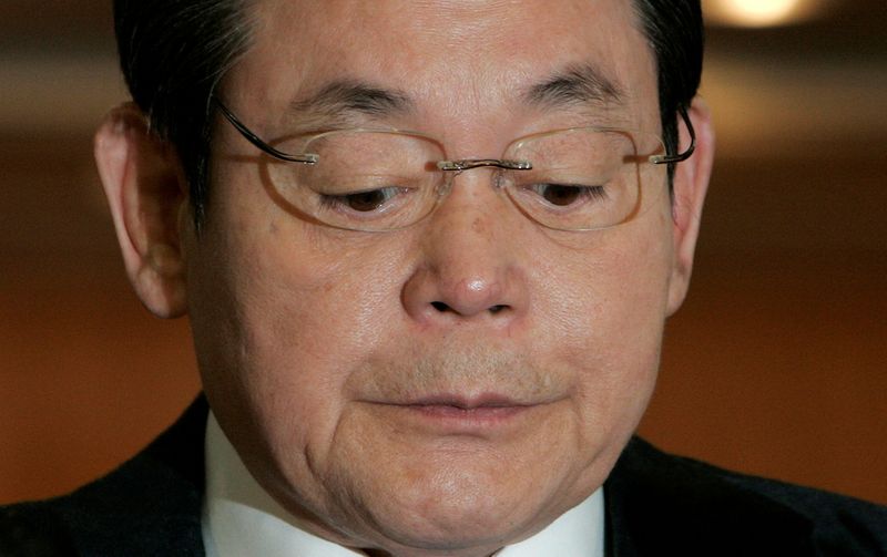 FILE PHOTO: Samsung Group Chairman Lee reacts during a news