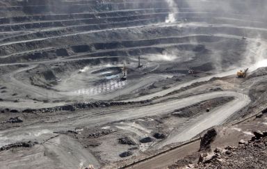 Miners are seen at the Bayan Obo mine containing rare