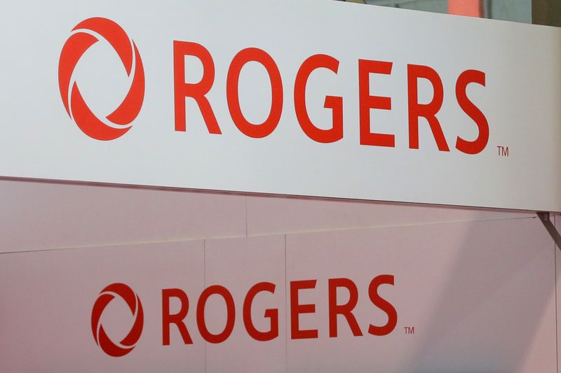 FILE PHOTO: Rogers Communications logos are seen above a booth