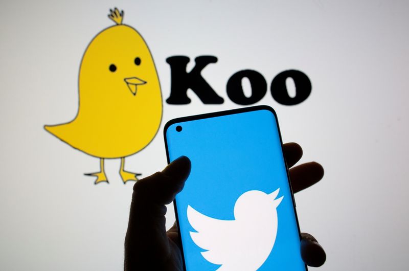 FILE PHOTO: Twitter logo is seen on smartphone in front