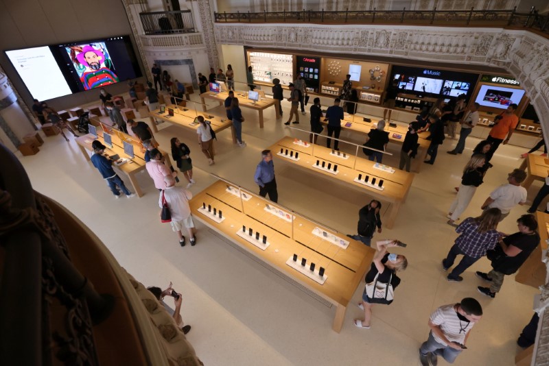 FILE PHOTO: Customers browse products at the new Apple Store