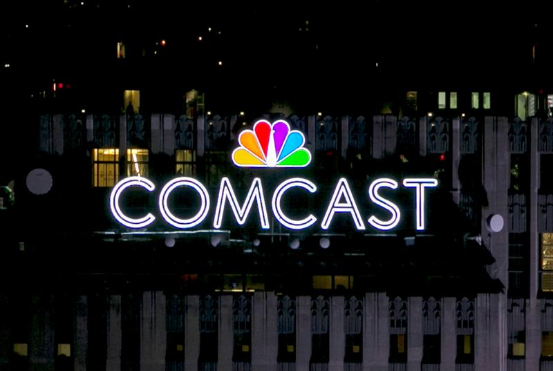 FILE PHOTO: The NBC and Comcast logo are displayed on