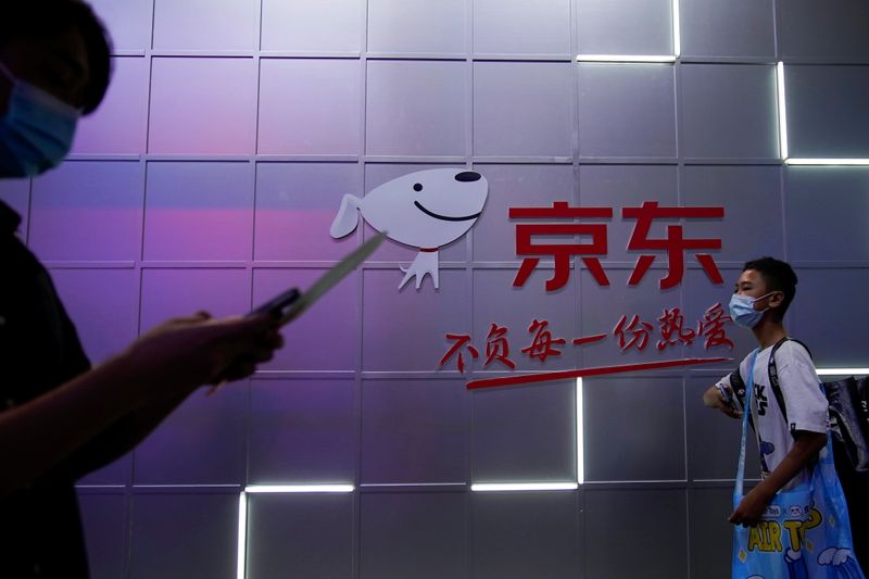 A sign of JD.com is seen at the China Digital