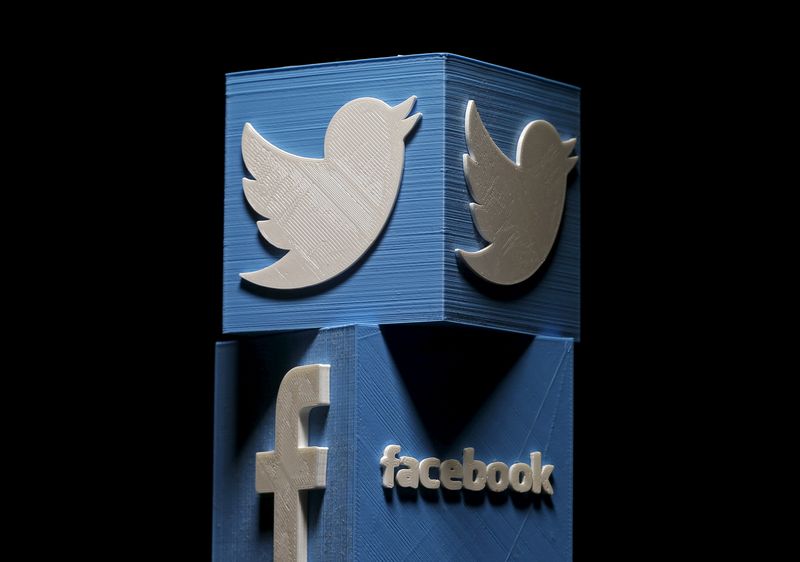 3D-printed Facebook and Twitter logos are seen in this picture