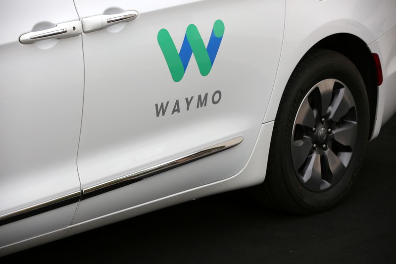 A Waymo Chrysler Pacifica Hybrid self-driving vehicle is parked and
