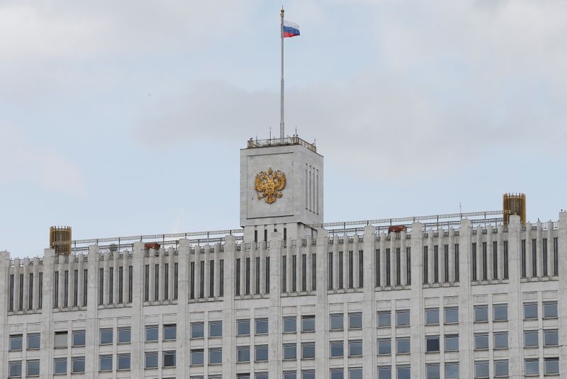 FILE PHOTO: National flag flies over Russian government headquarters in