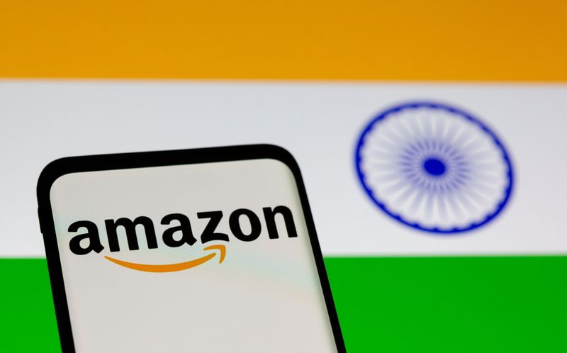 FILE PHOTO: Smartphone with Amazon logo is seen in front