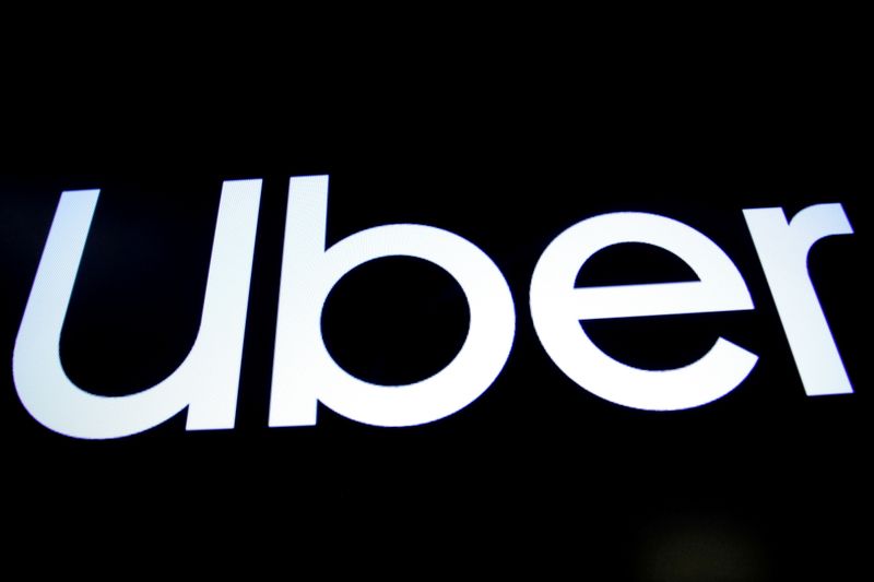 FILE PHOTO: A screen displays the company logo of Uber