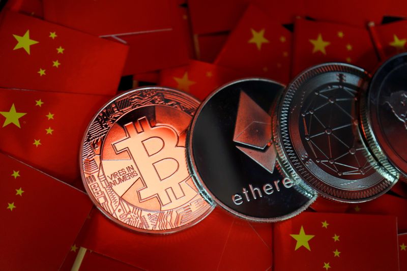 Picture illustration of China’s flags and cryptocurrencies