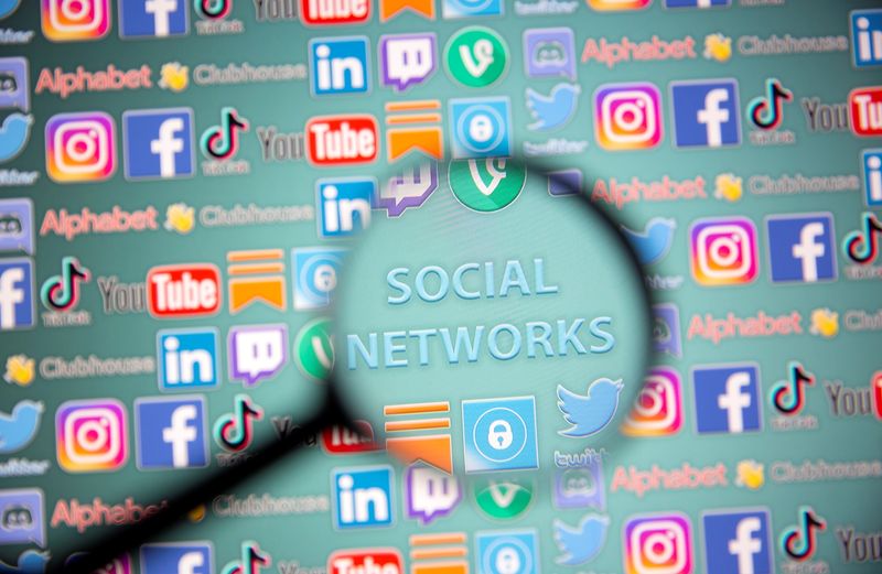 Social network words and social media logos are seen through