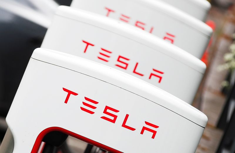 The logo of car manufacturer Tesla is seen at a