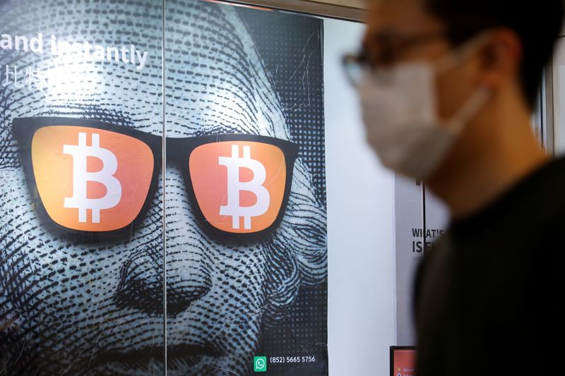 An advertisement for Bitcoin and cryptocurrencies is seen in Hong