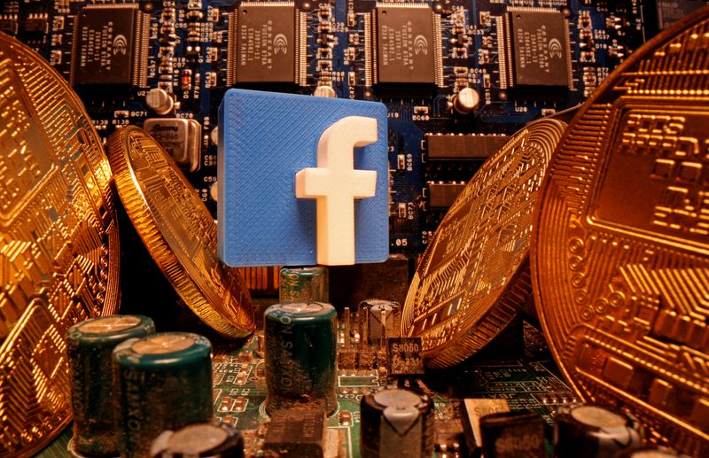 A 3D-printed Facebook logo and representations of cryptocurrency are standing
