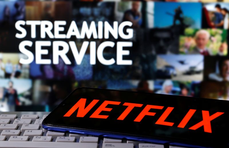 A smartphone with the Netflix logo is seen on a