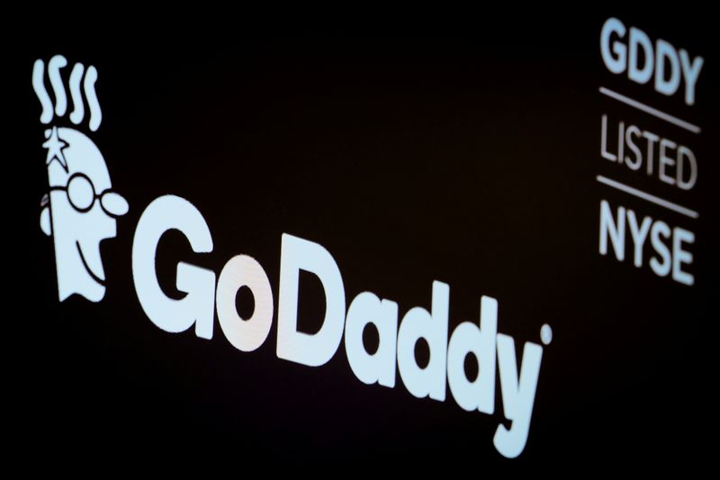 FILE PHOTO: The company logo and ticker for GoDaddy Inc.