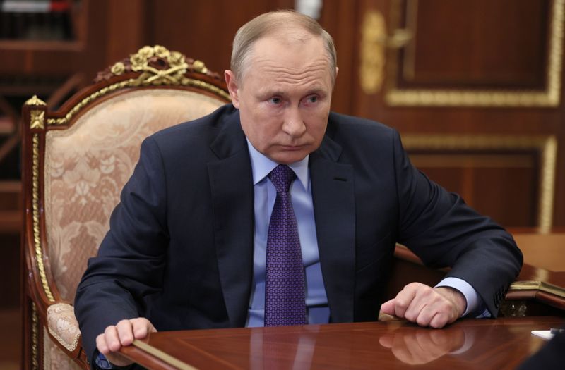 Russian President Vladimir Putin attends a meeting with head of
