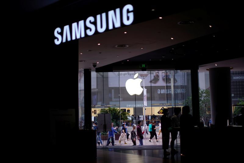 Logos of Apple and Samsung are seen at a main