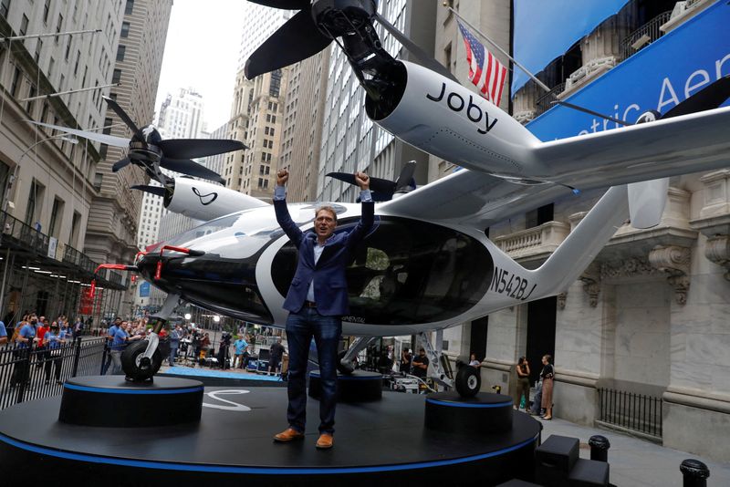FILE PHOTO: Joby Aviation founder JoeBen Bevirt poses next to