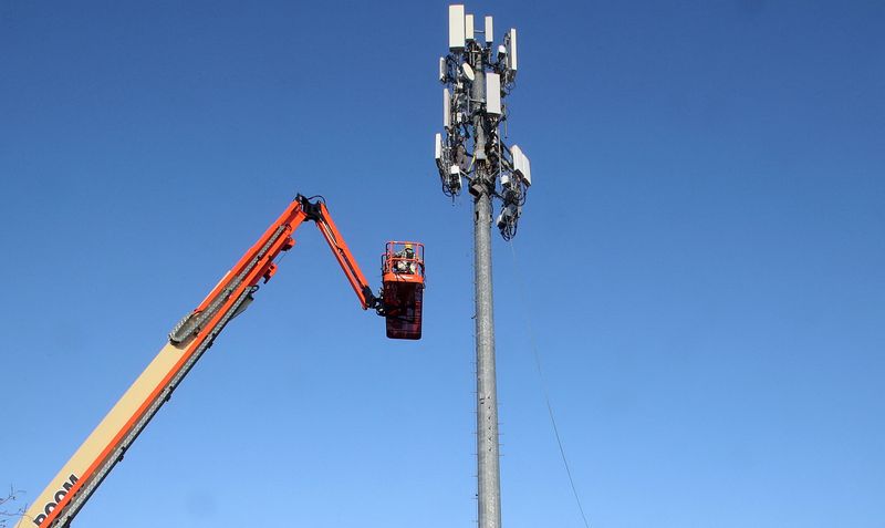 FILE PHOTO: A contract crew from Verizon installs 5G equipment